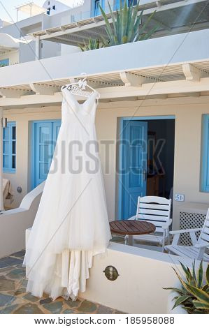 SANTORINI, GREECE - CIRCA AUGUST, 2015: wedding dress hanging in Andromeda Villas hotel. Andromeda Villas is a hotel are situated in Imerovigli, Santorini island.