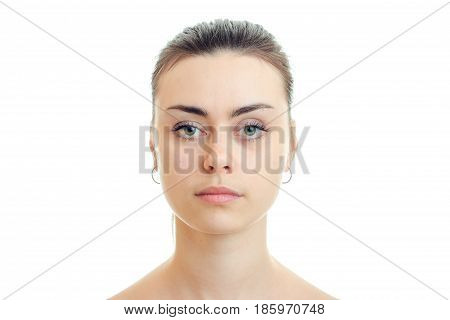 Portrait serious beautiful girls without makeup close-up isolated on white background