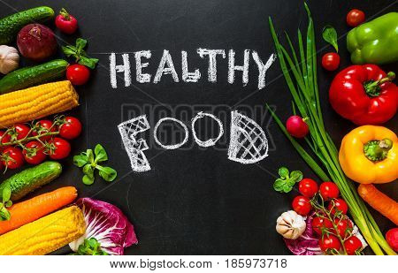 Photo of a table top full of fresh vegetables or healthy food background. Healthy food concept with fresh vegetables for cooking.Title 