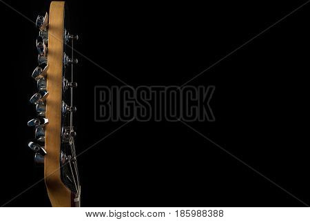 Music And Art. Electric Guitar On A Black Isolated Background. Horizontal Frame