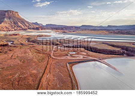 POTASH, UT, USA - MAY 7, 2017:  Aerial view of potash evaporation ponds managed by Intrepid Potash, Inc., the US largest producer of potassium chloride, located along the Colorado River, west of Moab.