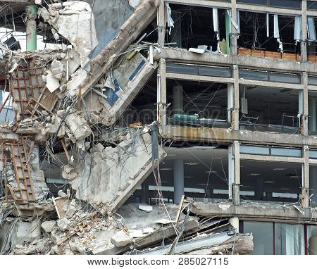 Full Frame Image Of A Large Destroyed Collapsing Building With Exposed Walls And Smashed Floors Fall