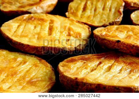 Baked Potato Halves. Ruddy Baked Potatoes In The Peel.