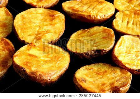 Baked Potato Halves. Ruddy Baked Potatoes In The Peel.