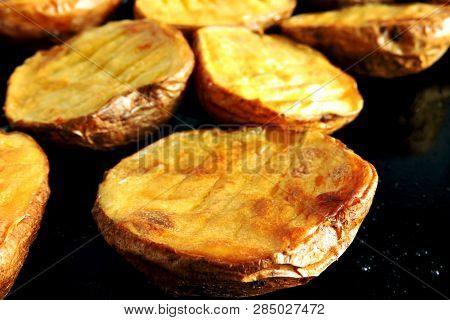 Baked Potato Halves. Ruddy Baked Potatoes In The Peel.