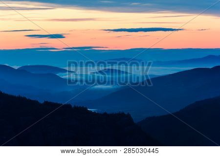 Foggy Sunrise Over Rodopi Mountain, Bulgaria. Mountain Landscape.