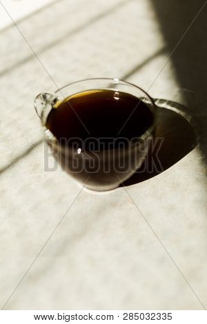 Black Coffee On The Breakfast In The Morning. Glass Cup And Sunny Weather.