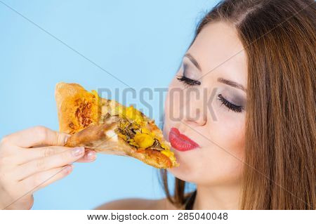 Woman Eating Hot Pizza Slice