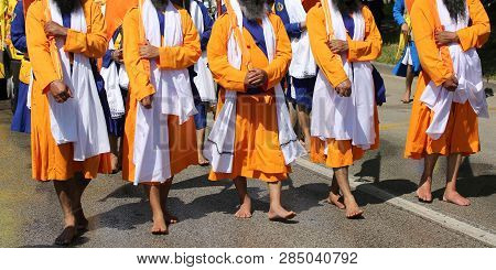 Men Of Sikh Religion On The Street With Swords During A Parade