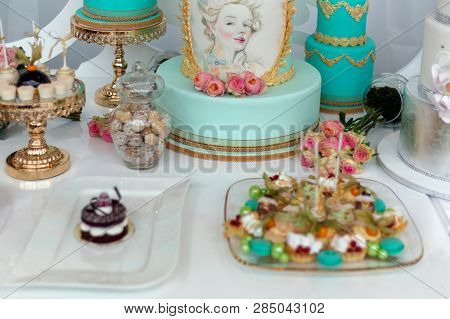 Timisoara, Romania - January, 14, 2017: Wedding Cake And Specific Sweets Decorated With Artificial F