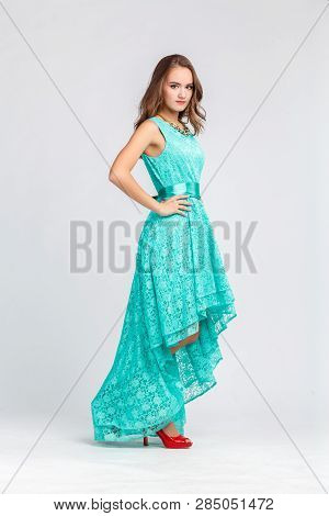 Beautiful Young Girl In Long Evening Turquoise Dress, Goes In Full Length, Motion, Gait, Guipure Dre