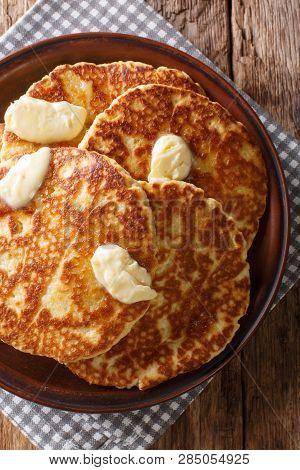 Delicious Grilled Pancakes With Butter Close-up On A Plate. Vertical Top View