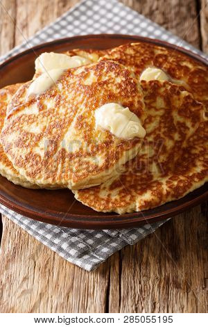Delicious Sweet Griddle Cakes With Butter Close-up On A Plate. Vertical