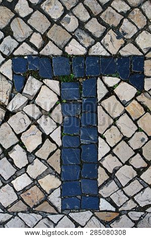 Portuguese Sidewalk Of Calcada In The Form Of The Letter T. Lisbon, Portugal