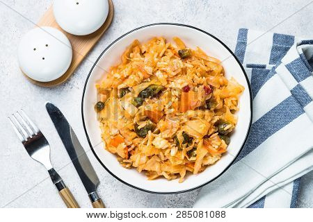 Cabbage Stew With Rice And Vegetables. Meatless Vegan Dish. Top View On Light Stone Table.