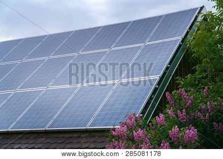 Solar Panels On Rood Of Modern Resiadental House, Renewable Energy System.