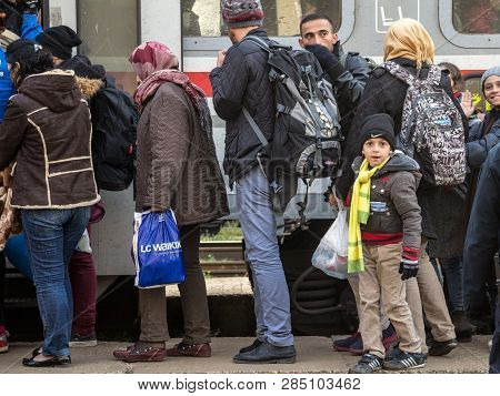Sid, Serbia - November 14, 2015: Refugees, A Family With A Child Boy, His Father And Mother, Boardin