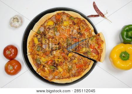 Pizza With Sauce, Bellpepper, Seasoning, Tomato In White Background