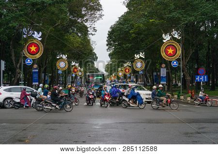 Ho Chi Minh City, Vietnam - August 23, 2017: Moving Traffic Crossing The Street During Rush Hour In 
