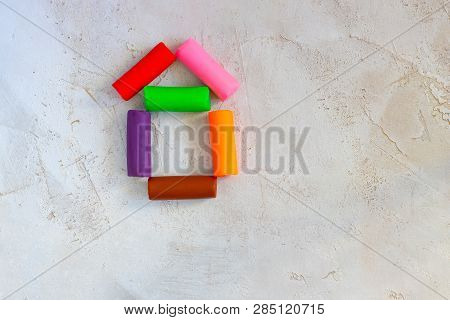 Colorful Clay Plasticine, Modelling Clay Placed Like House On Cement Background, Horizontal, Educati