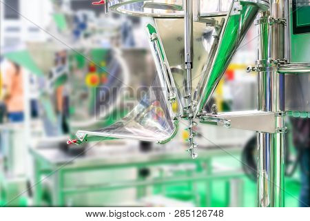 Close Up Stainless Steel Hoppers And Screw Feeder For Discharge And Volume Control Of Food Or Other 