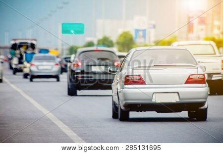 Car Parked On Road And Small Passenger Car Seat On The Road Used For Daily Trips
