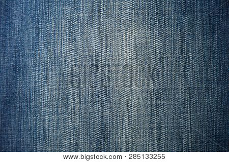Denim Chair. Modern Armchair Over Rustic Wall In Living Room Interior Redecoration Renovation Concep