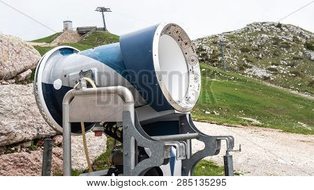 Snow Cannon In A Ski Resort. In The Alps. Ski Slope Without Snow During Warm Spring. Not Season.