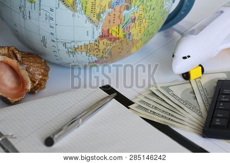 Planning A Trip Around The World. On Holiday With The Whole Family. In The Photo: Plane, Money, Shel