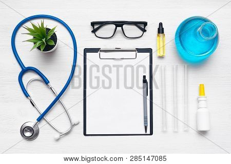 Medical Examination List Mockup. Laboratory Table With A Stethoscope, Blank Paper Sheet Of Researchi