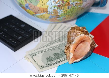 Planning A Trip Around The World. On Holiday With The Whole Family. In The Photo: Plane, Money, Shel