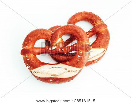 Two Traditional Bavarian Pastry Bretzes, Beer Snack. German Salty Bakery Pretzel, Isolated On White 