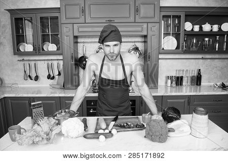 Attractive Chef Ready To Cook. Muscular Chef Posing In Kitchen. Cook Delicious Recipe. Sexy Macho Co