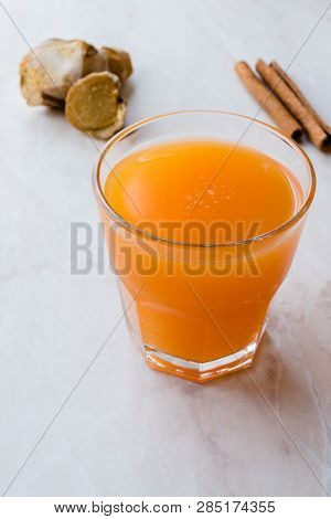 Jamu Healthy Asian Drink With Turmeric And Cinnamon Stick, Orange Juice