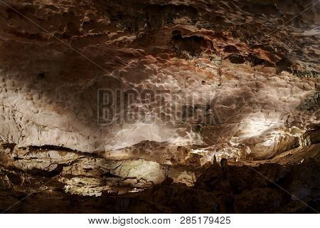 Cave Deep Dark Inside. Underground Of Stone Rock Mountain. Ha Long Vietnam Nature Background