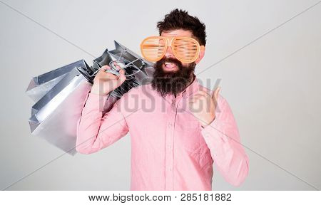 How To Get Ready For Your Next Vacation. Man Bearded Hipster With Lot Shopping Bags. Shopping On Bla