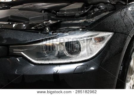 Macro View Of Modern Automobile In Autoservice With Auto Projector Lens. Mechanic Car Repair Service