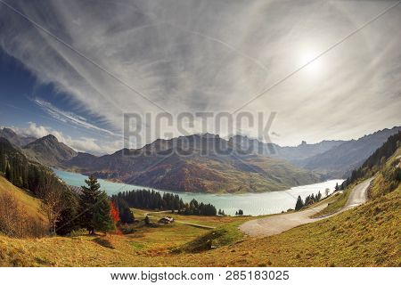 Mountains And Lake Roselend  With A Dike