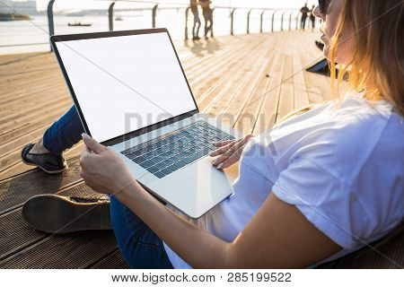 Hipster Girl Searching Information On Laptop Computer With Empty Screen Background For Advertising C