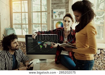 Pretty African American Long-haired Specialist Making Notes