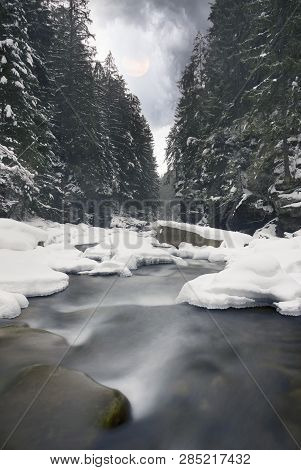 River And Icefalls In Winter In The Mountains
