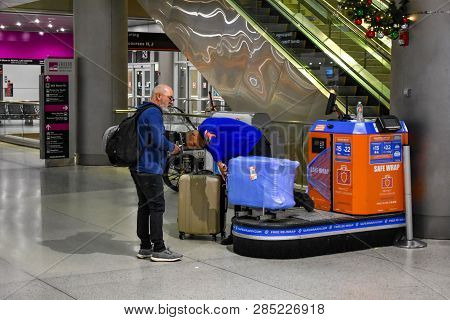 Miami, Florida. January 05, 2019. Person Packing Suitcases At Miami International Airport .