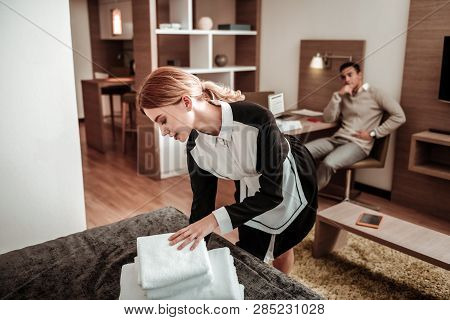 Beautiful Hotel Maid Bringing White Towels In The Morning
