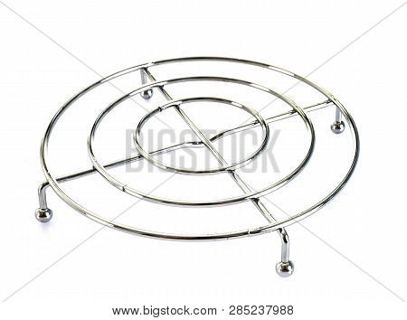 Metal Tablemat In Front Of White Background