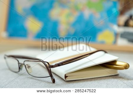 Diary, journal and reading glasses. Old-fashioned way to keep organized.