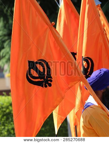 Big Orange Flag And Symbol Of Sikh Religion