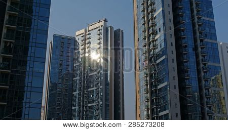 Glass of building with sunlight flare