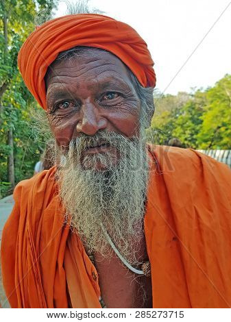 Tiruvanamalai, India - January 5, 2019:  Indian sadhu in the streets from Tiruvanamalai in India
