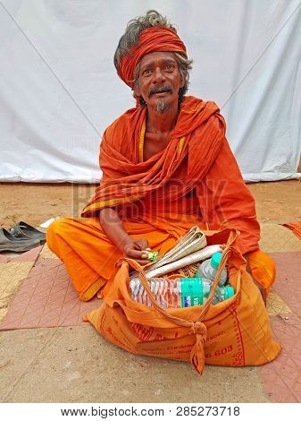 Tiruvanamalai, India - January 5, 2019:  Indian sadhu in the streets from Tiruvanamalai in India