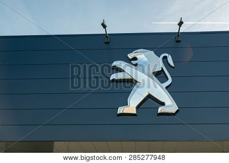 Roncq,france-february20,2019: View Of The Peugeot Brand Dealership Store On A Blue Sky Background.pe